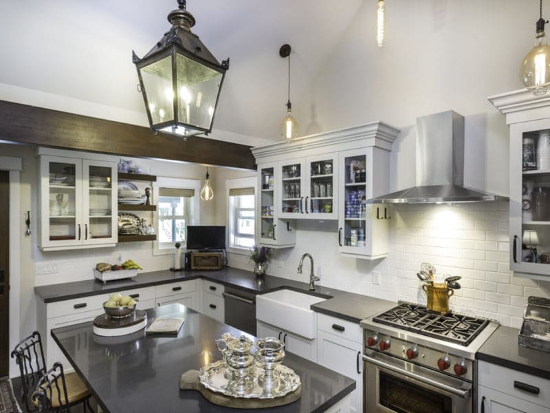 Kitchen construction with new countertops, lights and stone wall