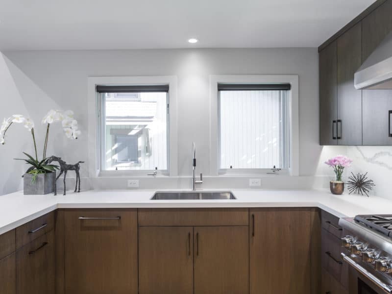 Kitchen sink with new cabinets and countertops