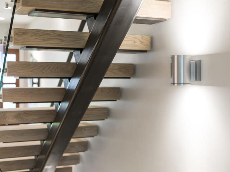 Hardwood stairs built in a residential home back view