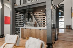 Wine rack under a set of stairs