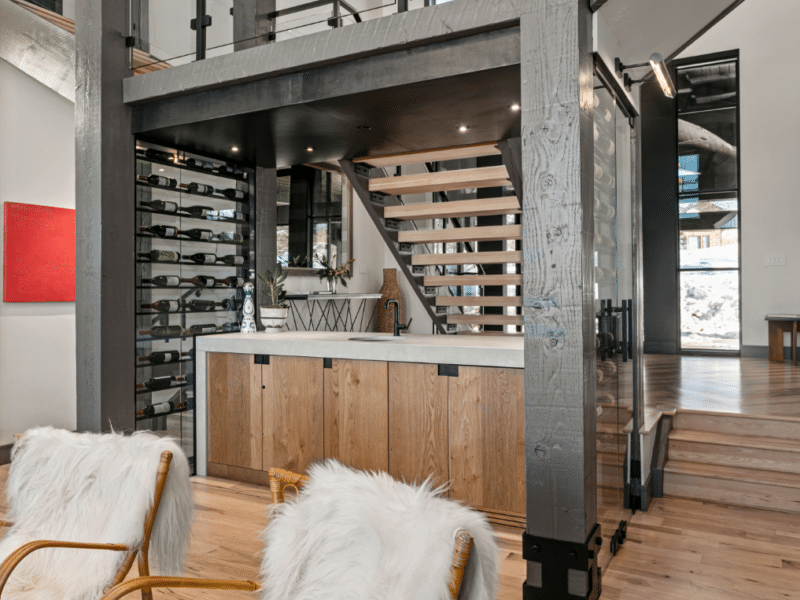 Wine rack under a set of stairs
