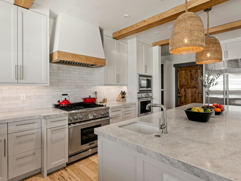 Kitchen island with custom countertops leading to stove