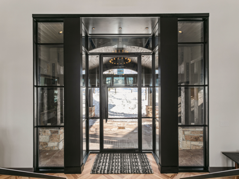 Home's entry way with custom wood and glass