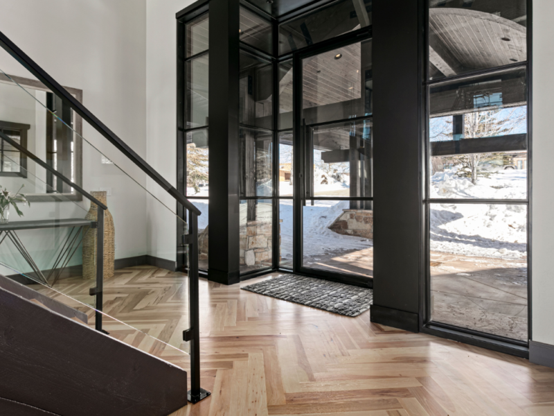 Side view of home's entry way with black wood
