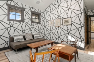 Guest room with spiderweb wallpaper