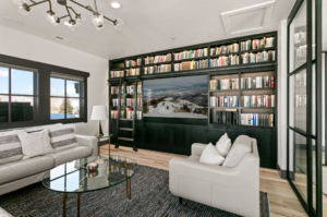 Home's library with tv in the wall