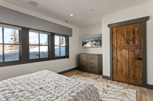 Custom bedroom with wood door installed