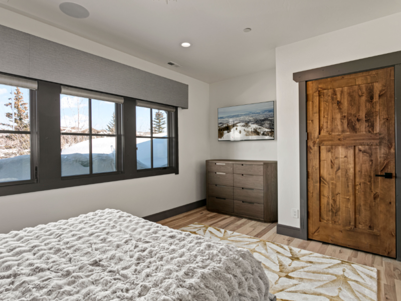Custom bedroom with wood door installed