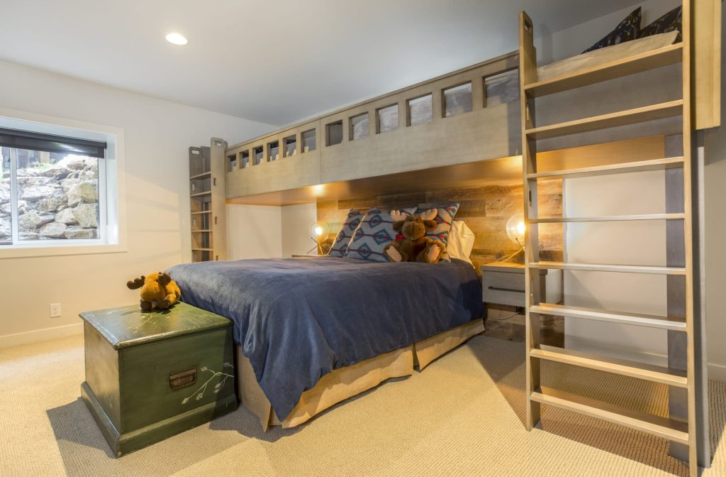 Basement bedroom with top bunk built in 3