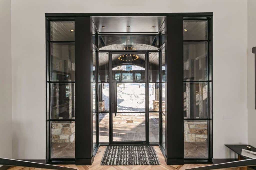 Home's entry way with custom wood and glass