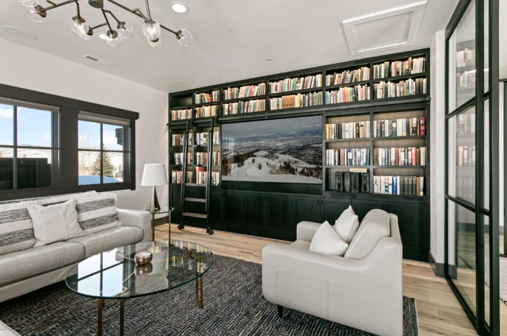 Home's library with tv in the wall